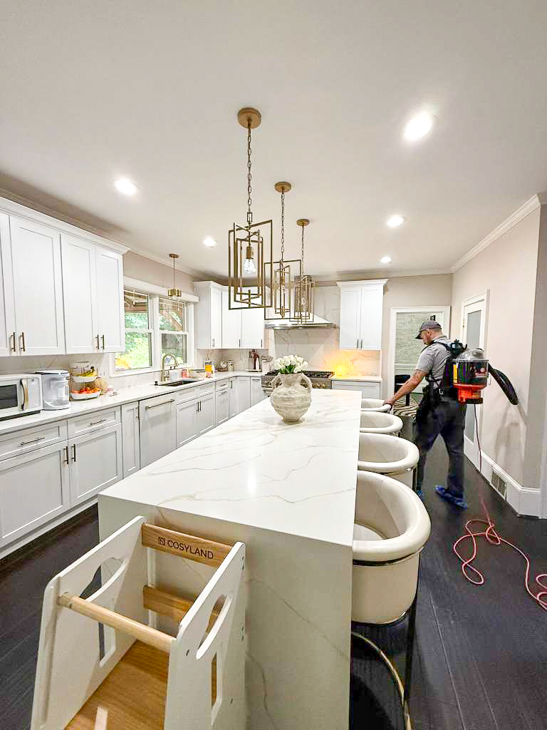 Modern white kitchen cleaned during recurring service